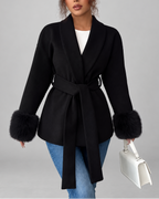 Women's belted jacket with faux fur cuffs in black - front