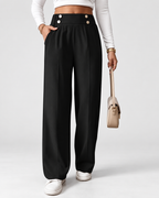 Black high waisted wide leg office trousers styled with knit