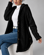 Black longline teddy fleece cable knit jacket seated