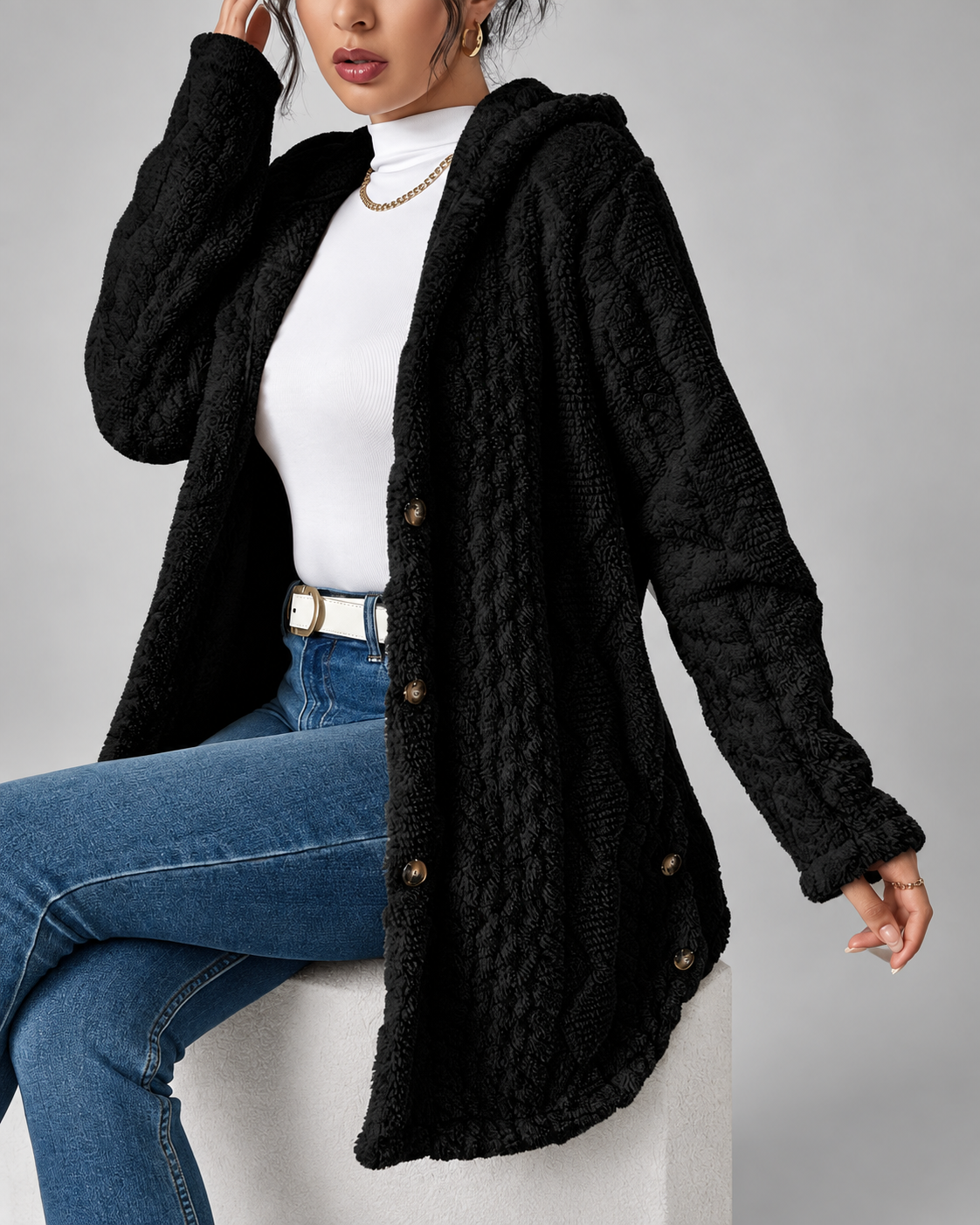 Black longline teddy fleece cable knit jacket seated