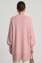 Women's Oversized Knitted Jumper with Crew Neck and Asymmetric Hem - Pink