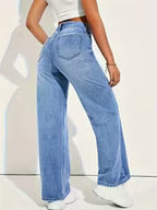 Mid blue high rise wide leg jeans styled with crop top
